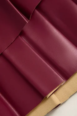 MICAS Skirts-Solid Faux Leather Pleated Asymmetrical Skirt